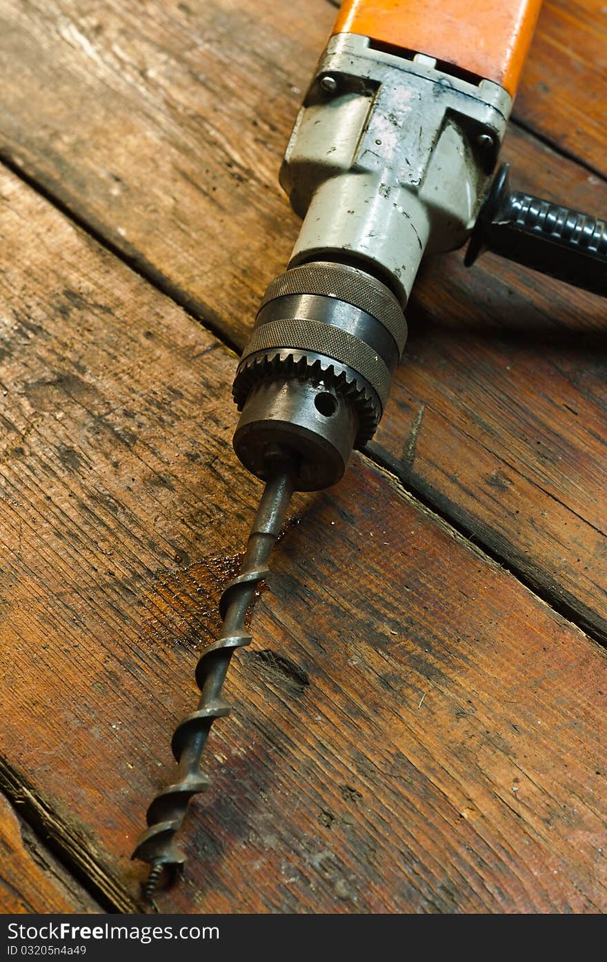 Drill closeup on wooden background. Drill closeup on wooden background