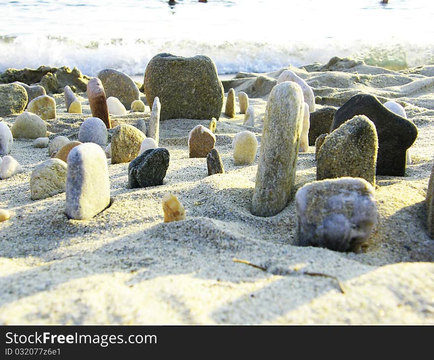 Pebbles in the sand on beach. Pebbles in the sand on beach