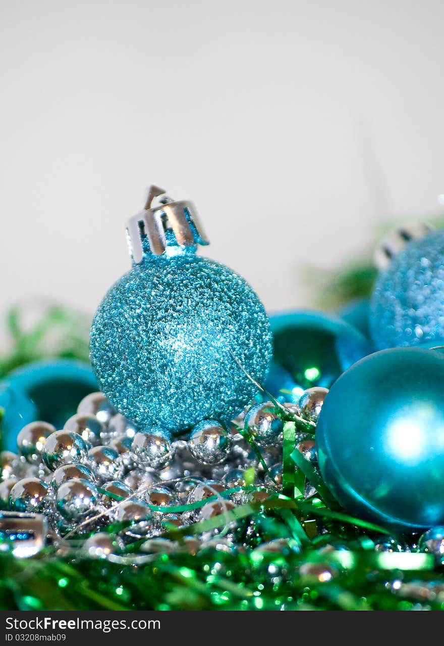 Blue Christmas balls laying on the table, white background. Blue Christmas balls laying on the table, white background