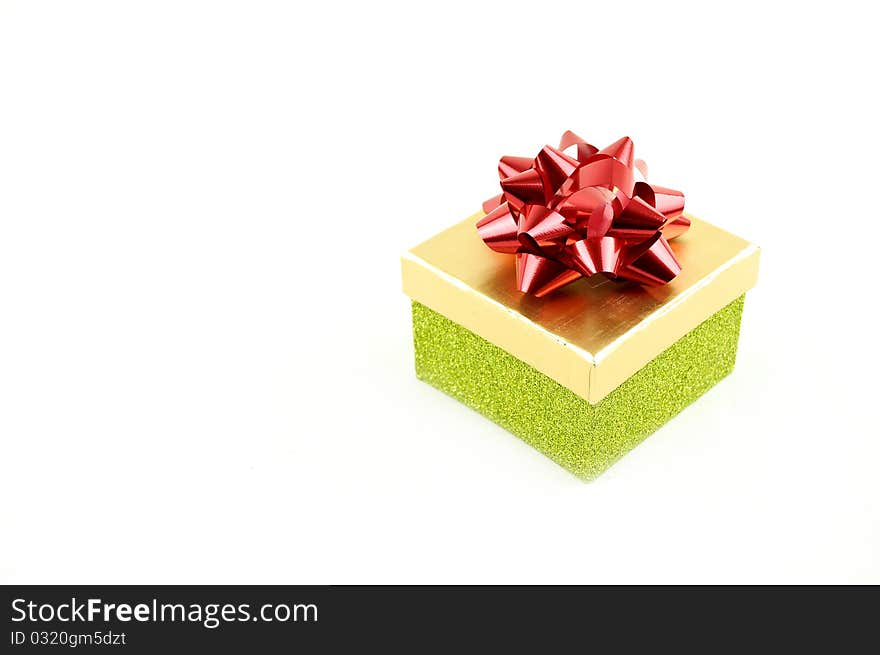 Gift  box with red ribbon  on a white buckground. Gift  box with red ribbon  on a white buckground