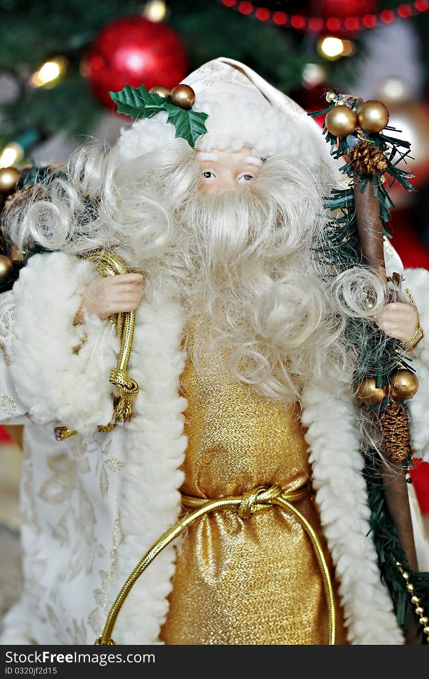 Porcelain Santa figurine with bag and staff. Porcelain Santa figurine with bag and staff.