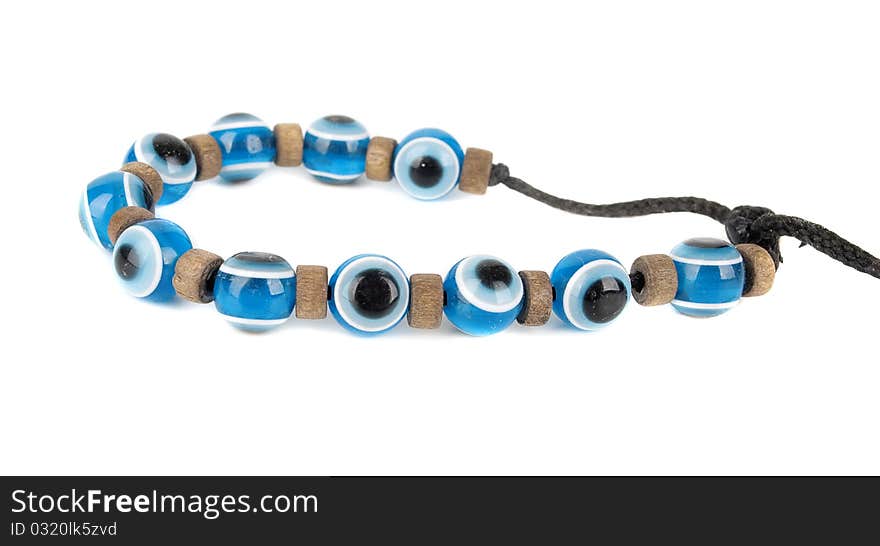 Evil eye children summer bracelet . Mediterranean people believed that evil eye keeps evil things away. Isolated on the white background. Evil eye children summer bracelet . Mediterranean people believed that evil eye keeps evil things away. Isolated on the white background.