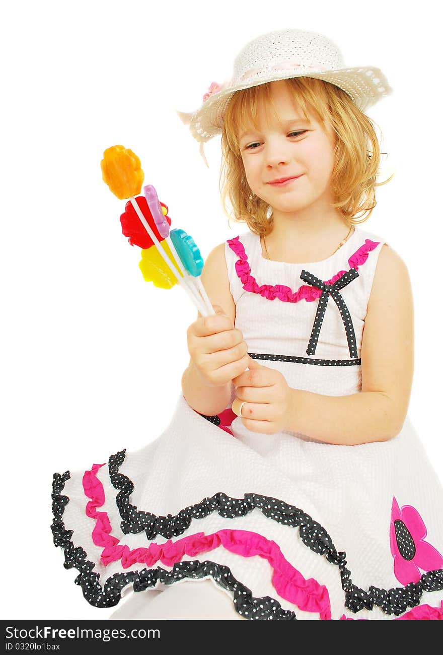 Portrait of little girl with lollipops isolated on the white background. Portrait of little girl with lollipops isolated on the white background.