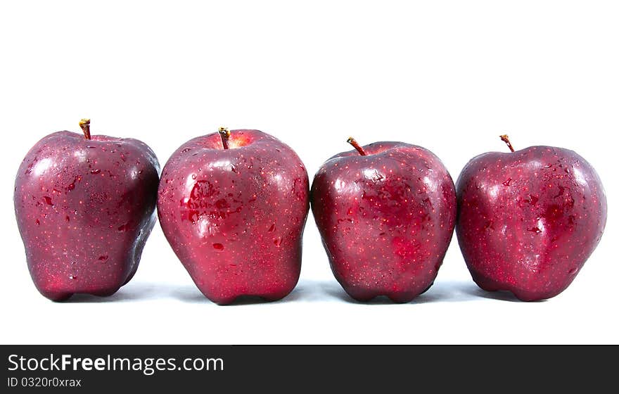 Four red apple isolated on white