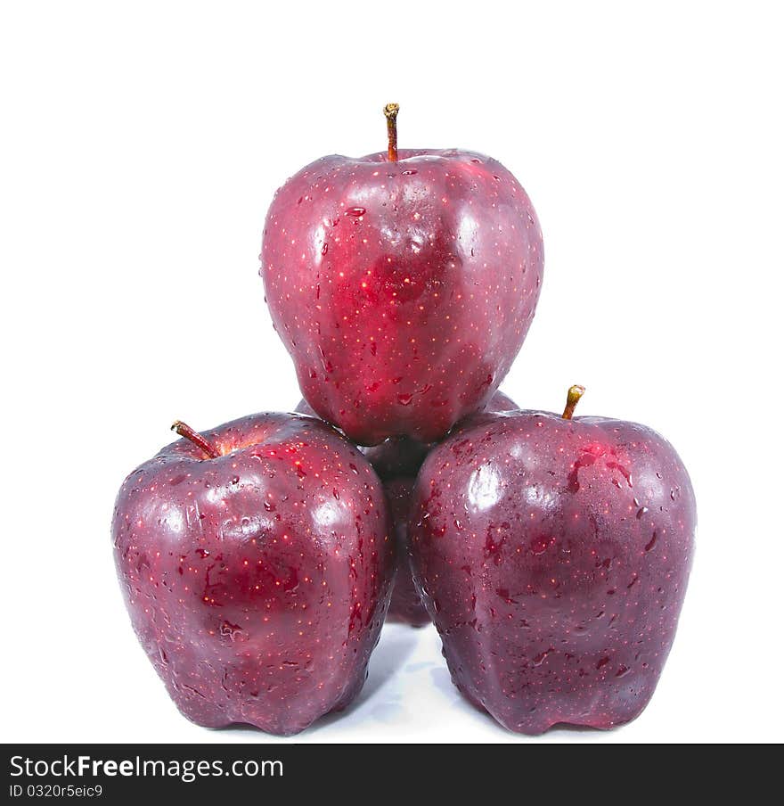 Four red apple balance isolated on white