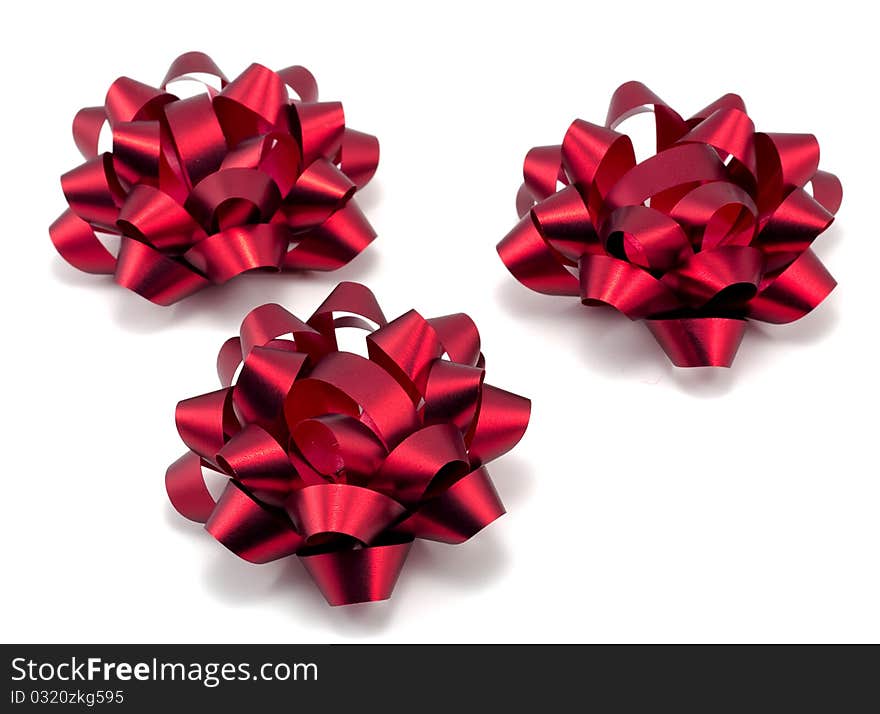 Three red christmas bows