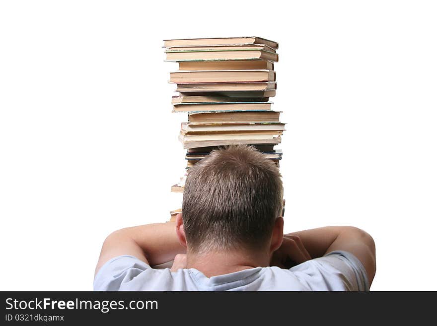 Desperate man in front of books pile