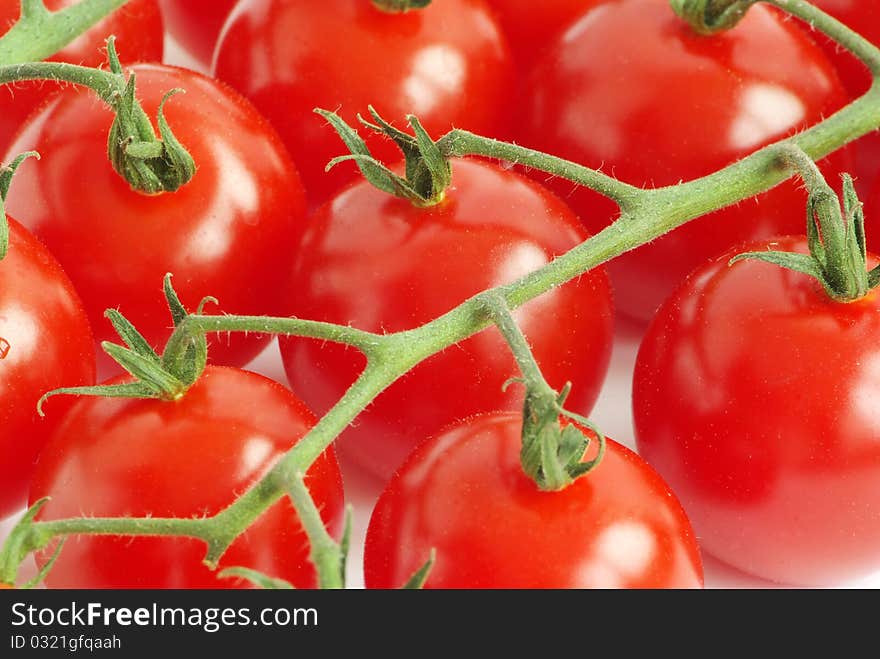 Bunch of fresh cherry tomato on white background. Bunch of fresh cherry tomato on white background