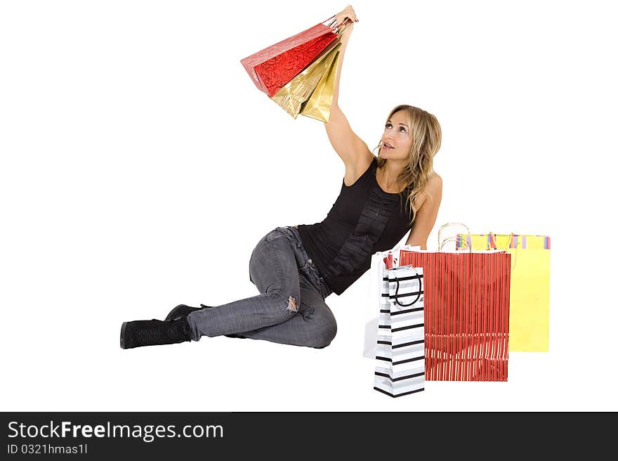 blond woman with shopping bags smiling happily. blond woman with shopping bags smiling happily