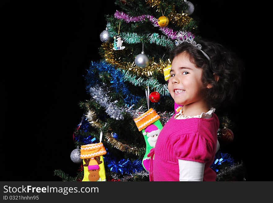 A girl and a christmas tree with presents. A girl and a christmas tree with presents