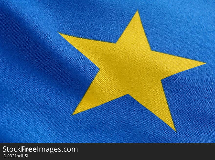 Part of a european flag, one yellow star on blue ground