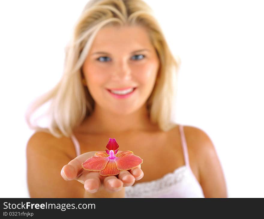 Beautiful young fresh female holding a flower. focus on flower. isolated on white