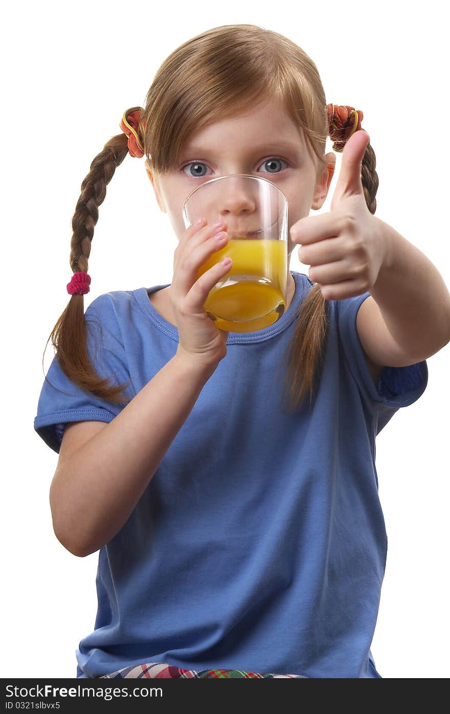 Young funny girl with a glass of juice over white background