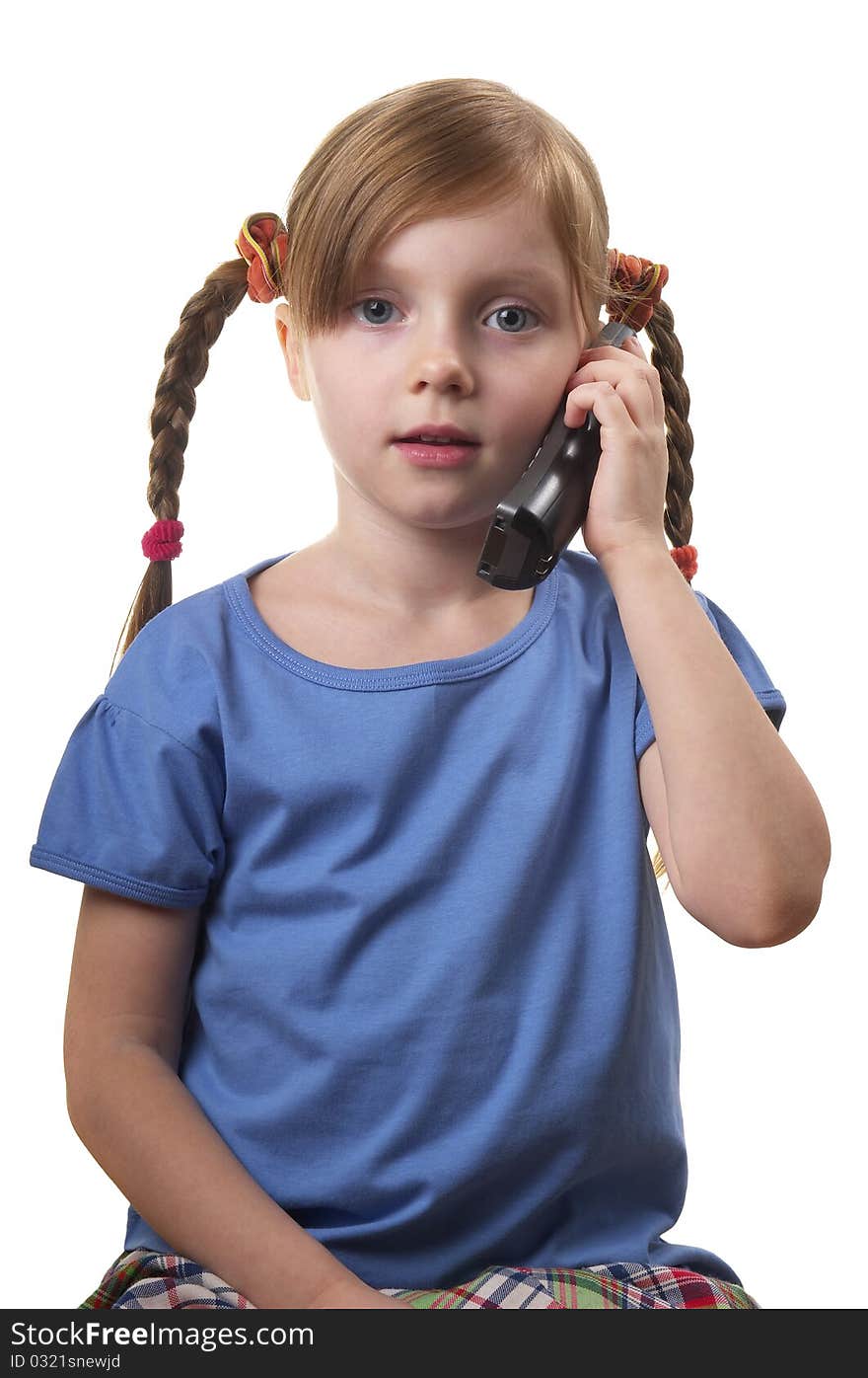 Funny smiling little girl takling by phone portrait isolated over white background. Funny smiling little girl takling by phone portrait isolated over white background