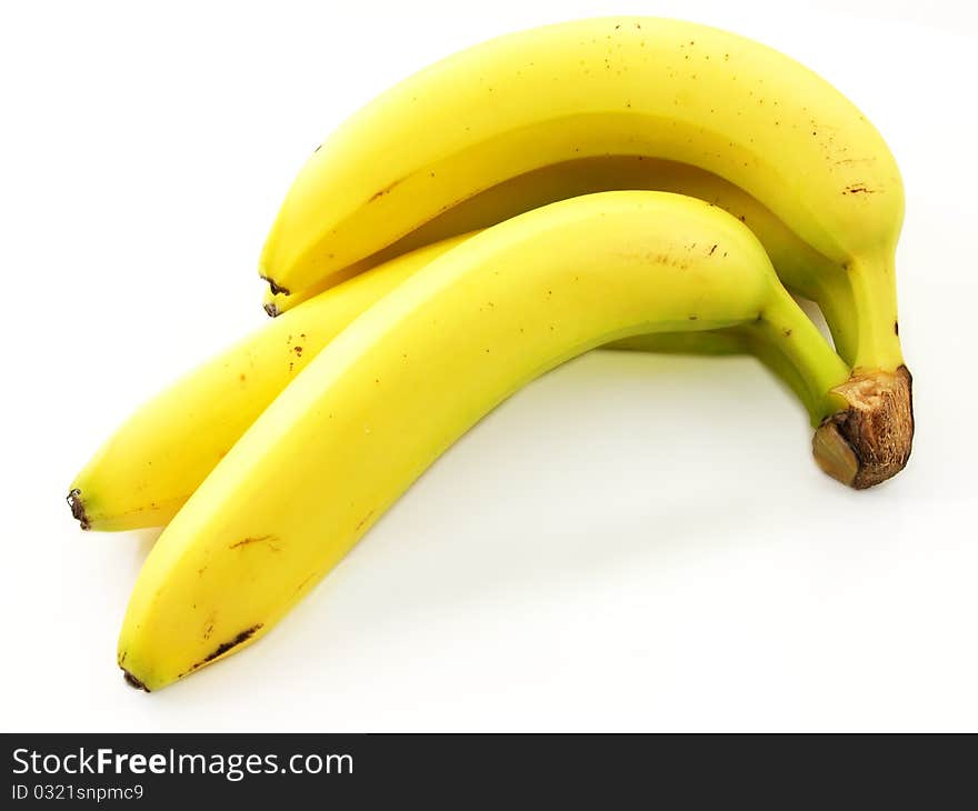 Group of bananas, connected towards white background