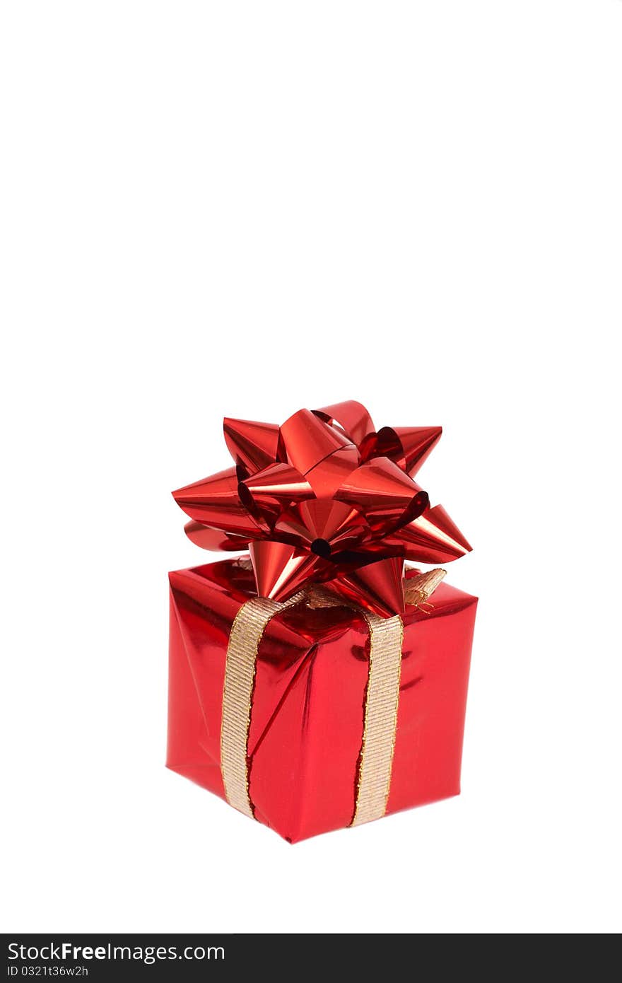 Red gift box with a bow for Christmas or Valentines Day