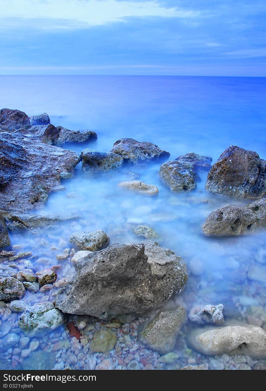 Sea and reflection in water during sundown. Sea and reflection in water during sundown