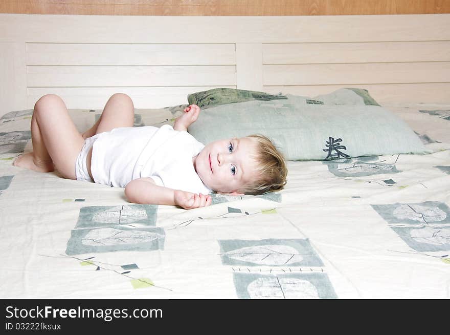 Cute child on parent's bed