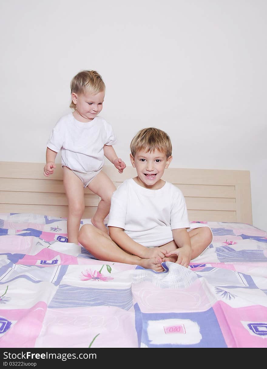 Two children on parent's bed