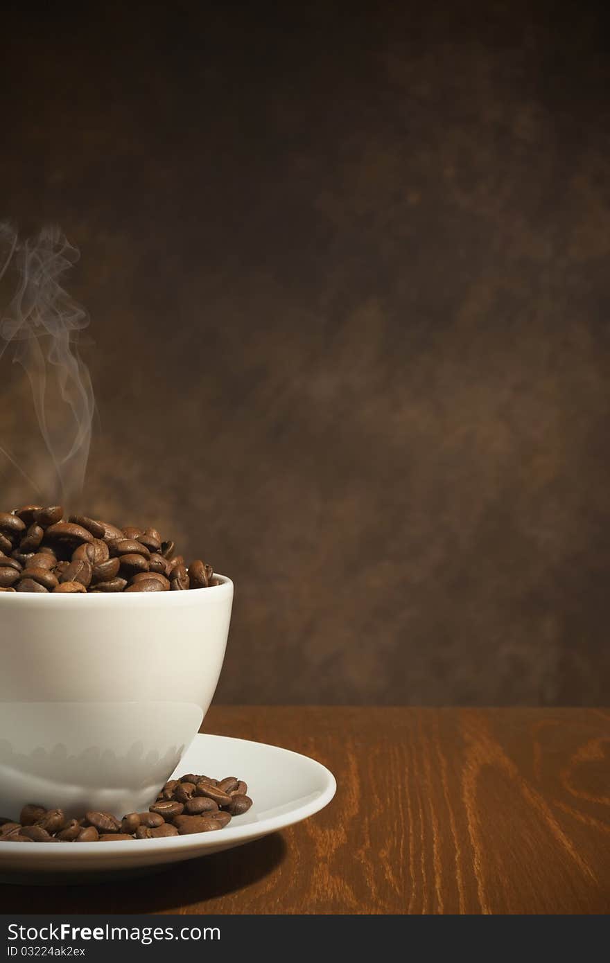 Close-up of a wonderful cup of cup of coffee, full of beans