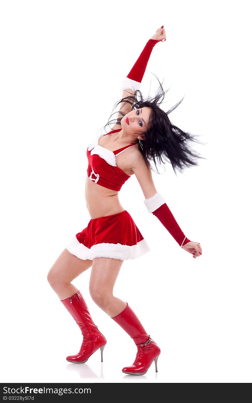 Girl dressed as Santa with fluttering hair on a white background