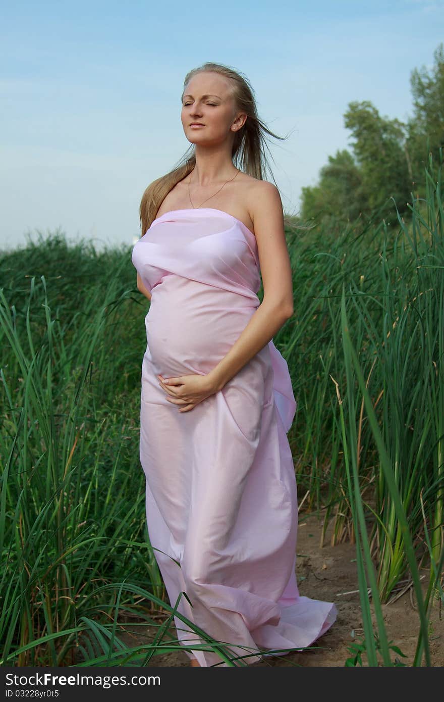 Beautiful Pregnant Woman In Nature.