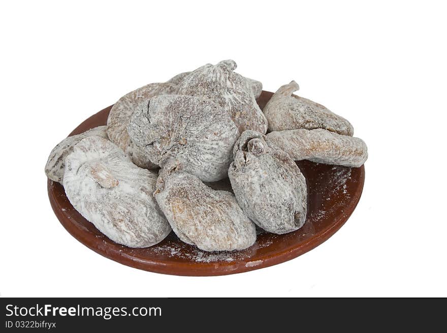 Dried figs in ceramic plate in isolated