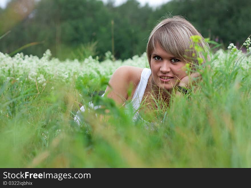 Beautiful girl lying on the grass. Beautiful girl lying on the grass