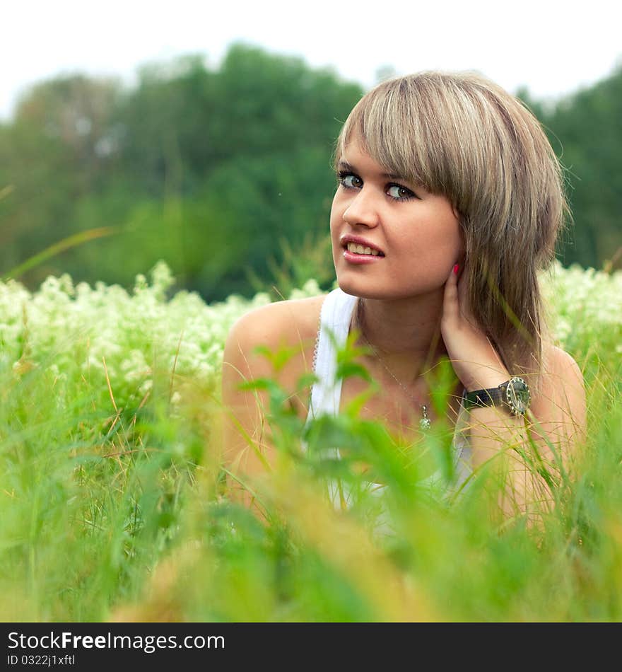 Beautiful girl lying on the grass. Beautiful girl lying on the grass