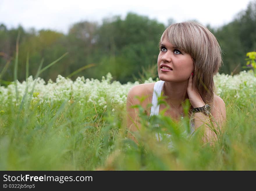 Beautiful girl lying on the grass. Beautiful girl lying on the grass