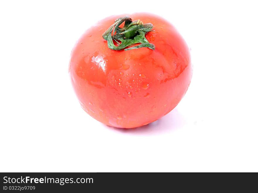 Juicy red tomatoes isolated on white background