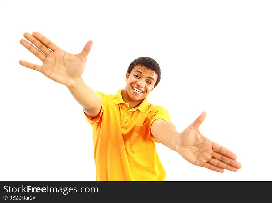 Success sign - A young man showing thumbs up sign over white background