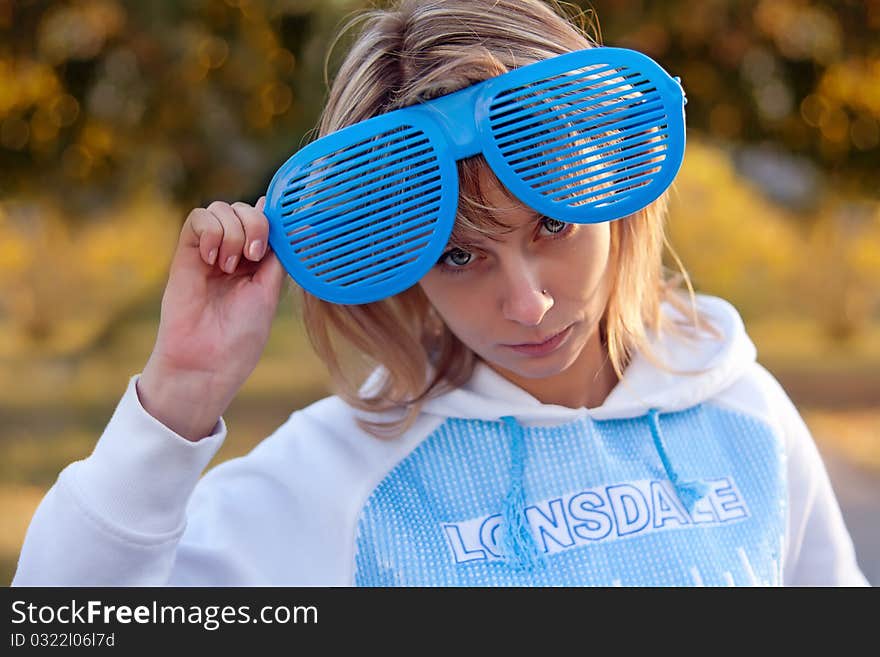 Portrait of a beautiful young woman with a big funny glasses. Portrait of a beautiful young woman with a big funny glasses