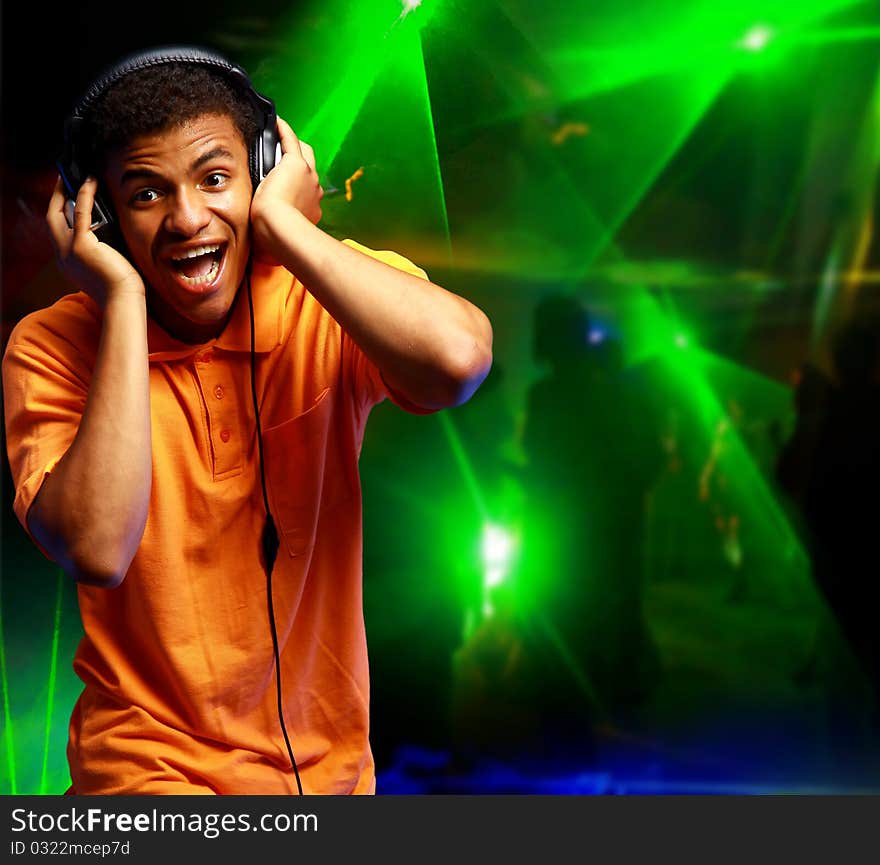 Boy is is listening to music in nightclub