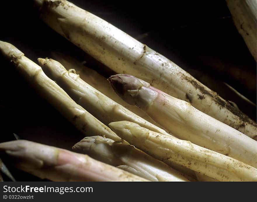 Bunch of asparagus in tin basket