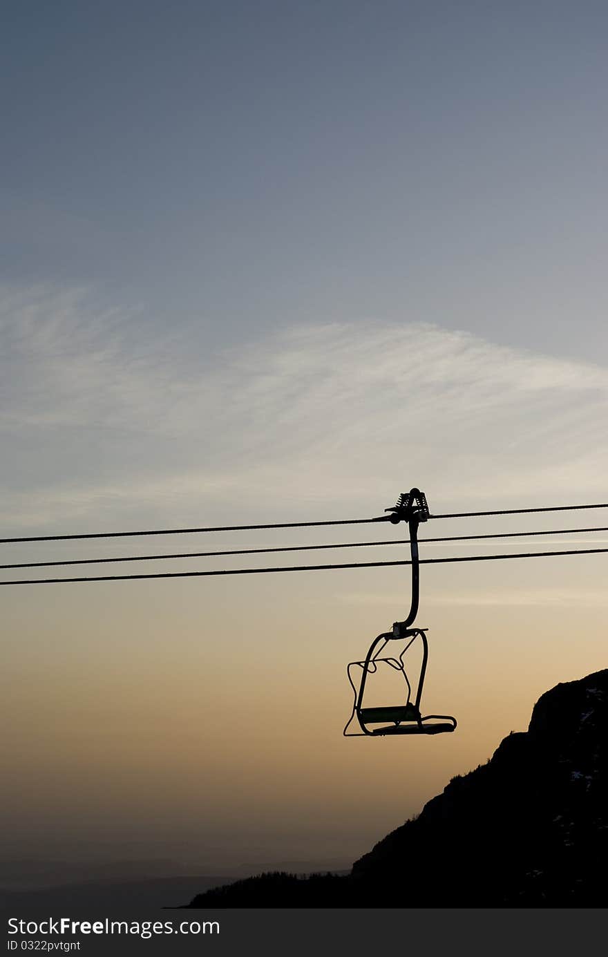 Chairlift In Sunset