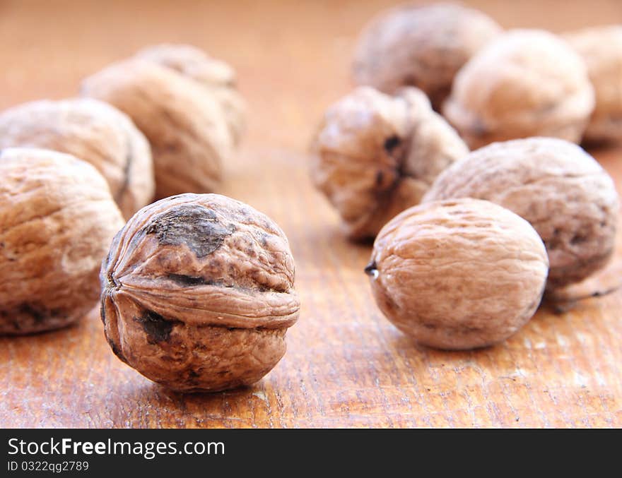 Macro view of walnut on a wooden structure