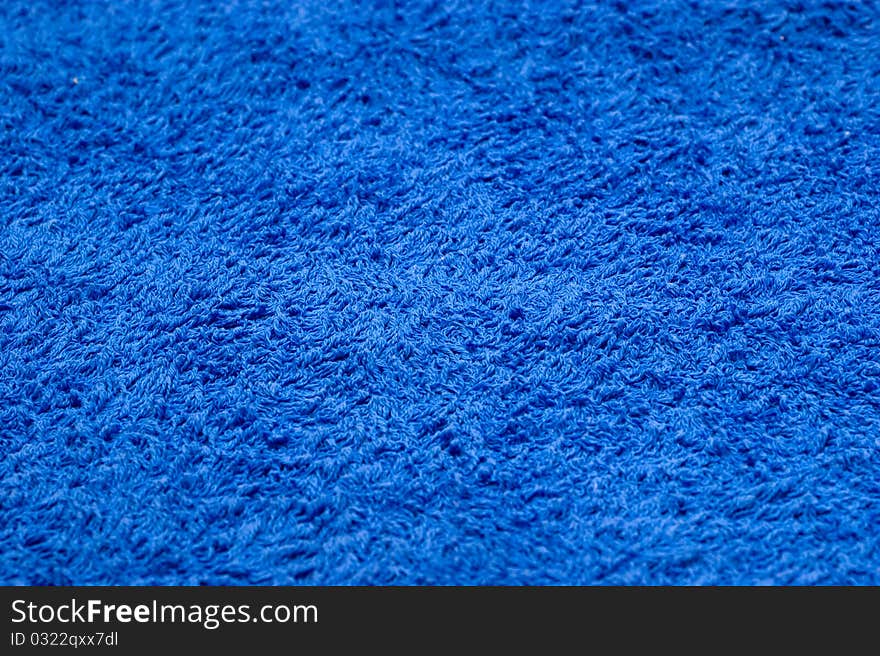 The background of textured blue cotton fabric closeup