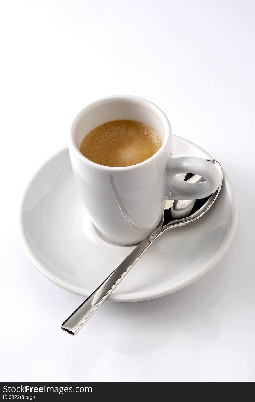 Presentation of a coffee with spoon.