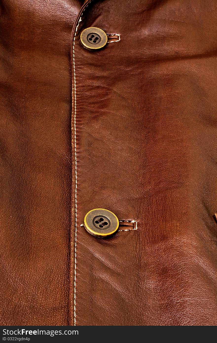 Detail of clothing and leather in brown. Detail of clothing and leather in brown