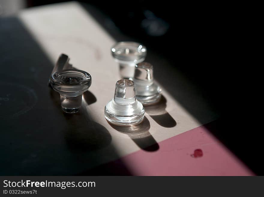 Closure for vine bottles laying on the table with light reflections.