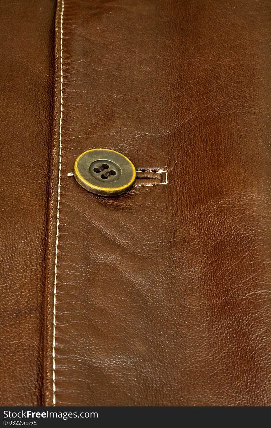 Detail of clothing and leather in brown. Detail of clothing and leather in brown