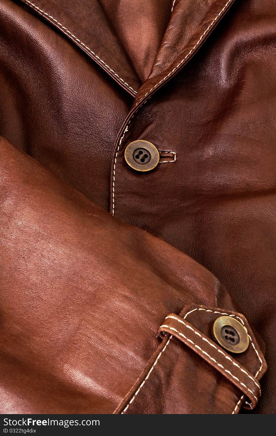 Detail of clothing and leather in brown. Detail of clothing and leather in brown