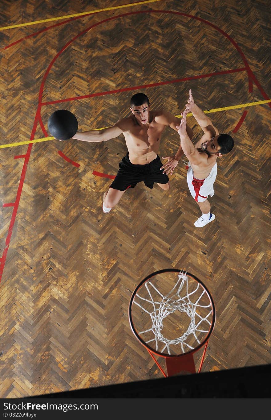 Young and healthy people man have recreation and training exercise while play basketball game at sport gym indoor hall. Young and healthy people man have recreation and training exercise while play basketball game at sport gym indoor hall