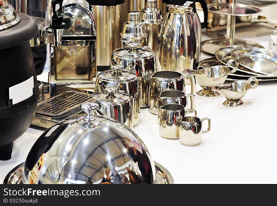 Turkish coffee pot (cezve) and traditional utensils of stainless on table