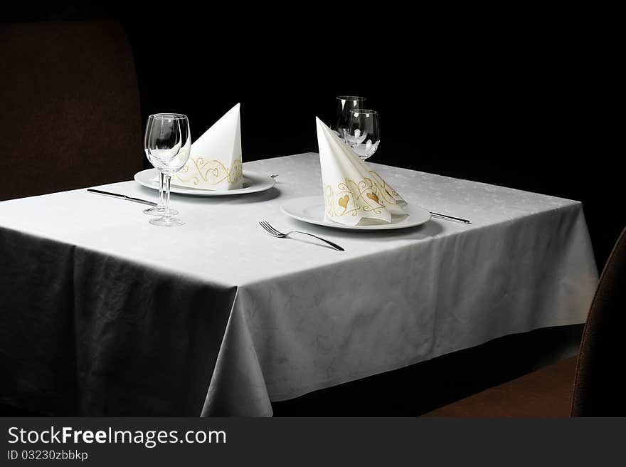 Tables set for meal in modern restaurant. Tables set for meal in modern restaurant