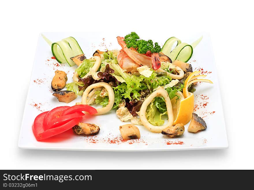 Seafood with vegetables and herbs on a ceramic platter. Seafood with vegetables and herbs on a ceramic platter