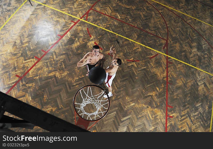 Young and healthy people man have recreation and training exercise while play basketball game at sport gym indoor hall. Young and healthy people man have recreation and training exercise while play basketball game at sport gym indoor hall