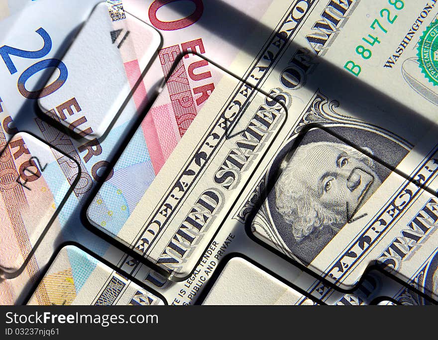 Dollar and Euro banknotes overlaid with keyboard abstract. Dollar and Euro banknotes overlaid with keyboard abstract