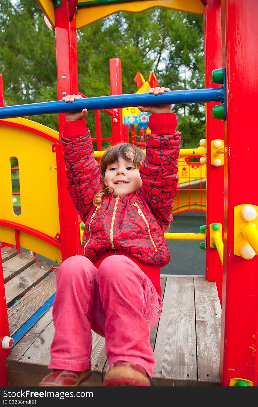 Little Girl Plays In Playground